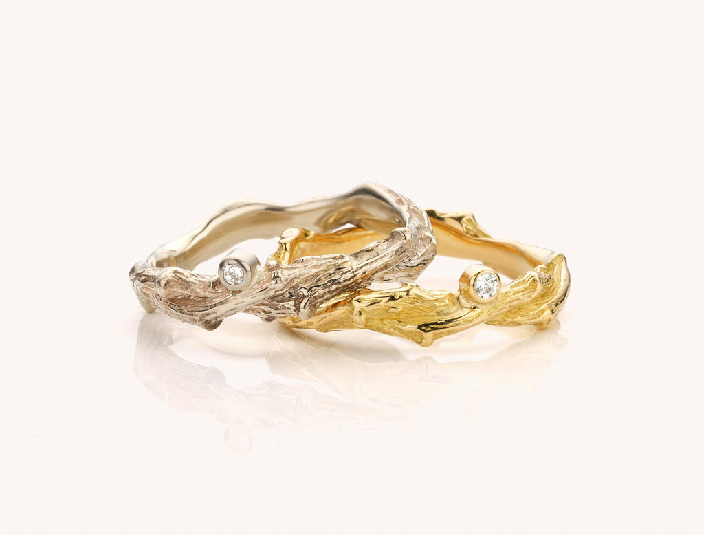gedraaide gouden ring met diamant